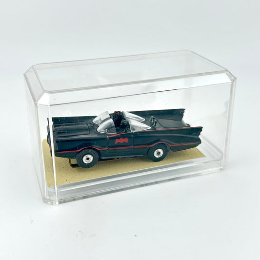 Model of the Batmobile in a clear display case on a white background