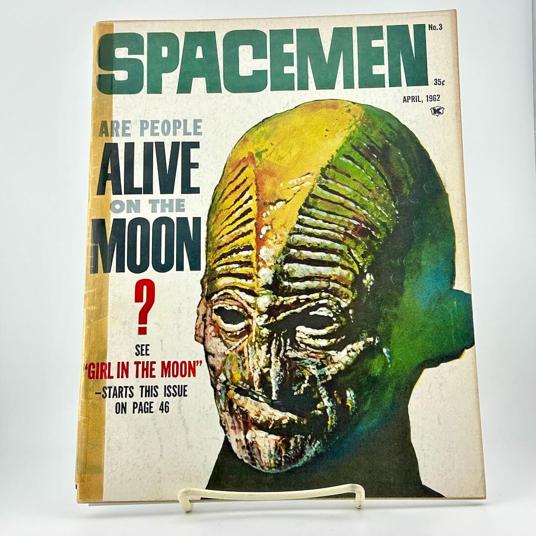 Vintage magazine cover with a space-themed cover featuring a creature's face and text about spacemen on the moon.