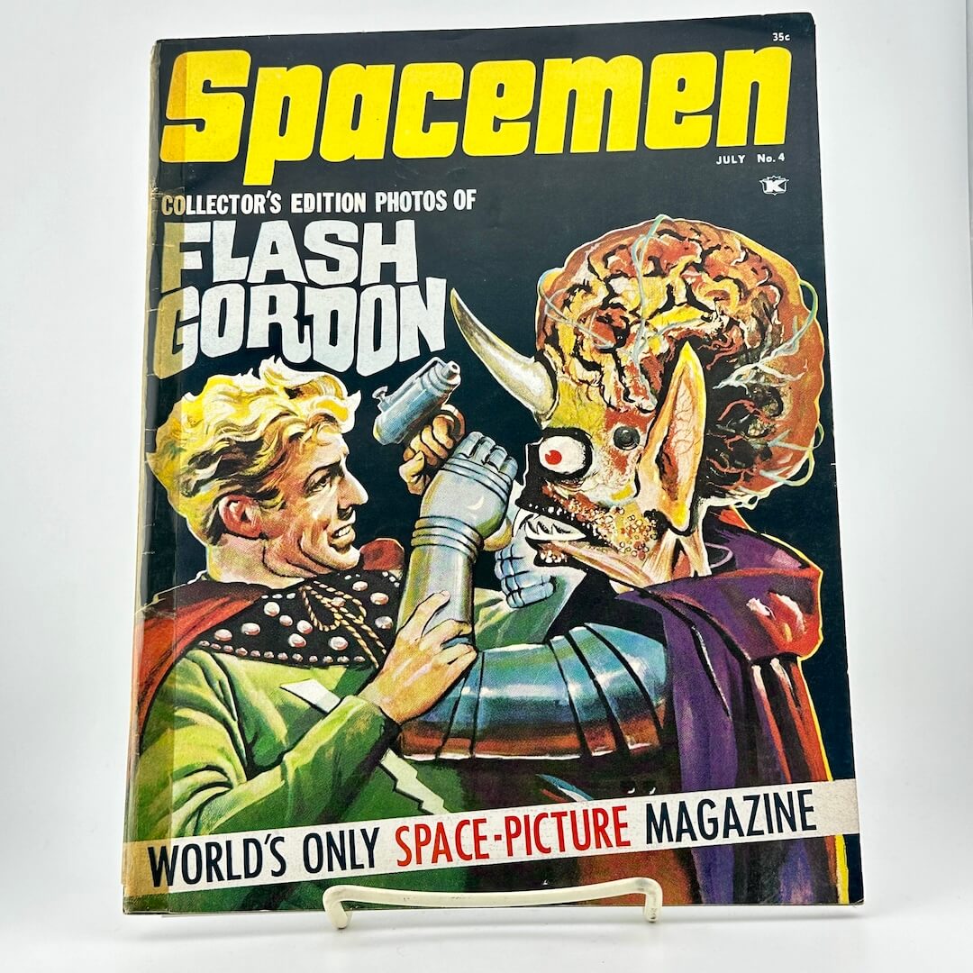 Vintage magazine cover featuring 'Flash Gordon' with a spaceman and alien on a white background