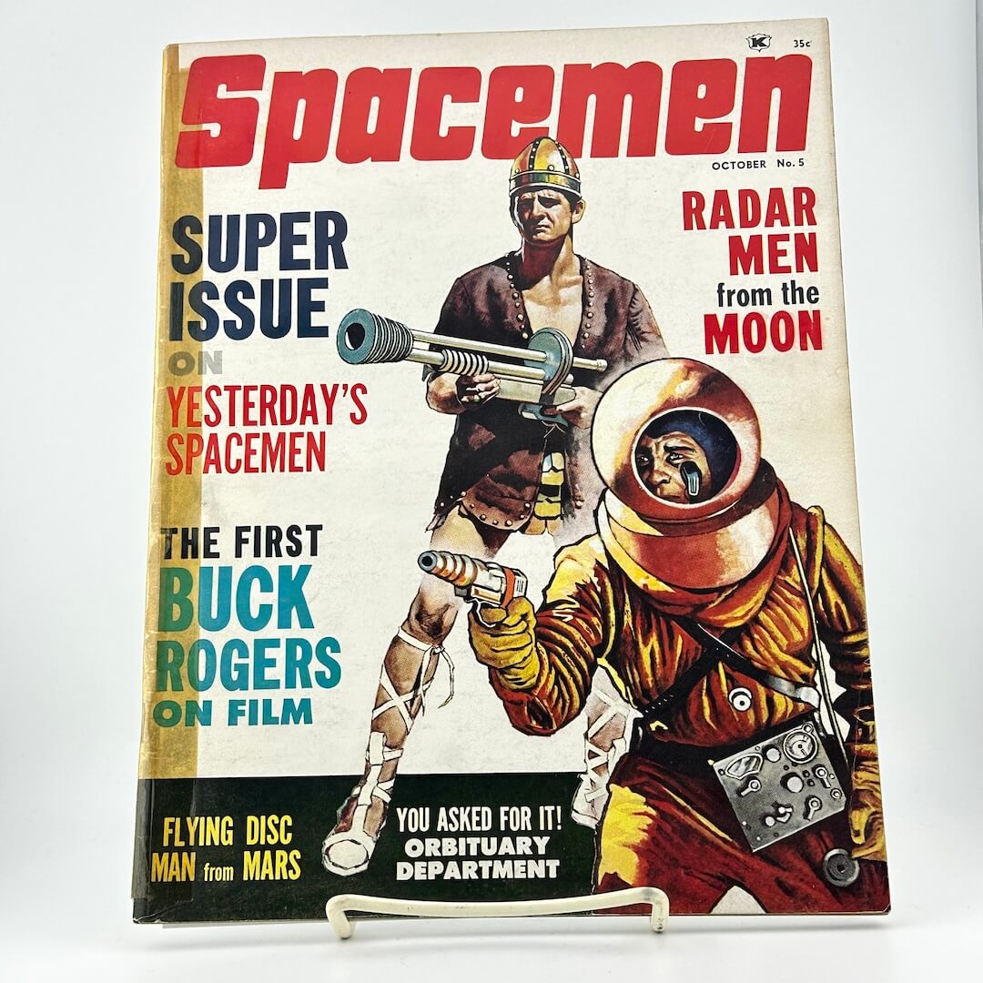Vintage magazine cover featuring space-themed artwork with two figures in futuristic attire.
