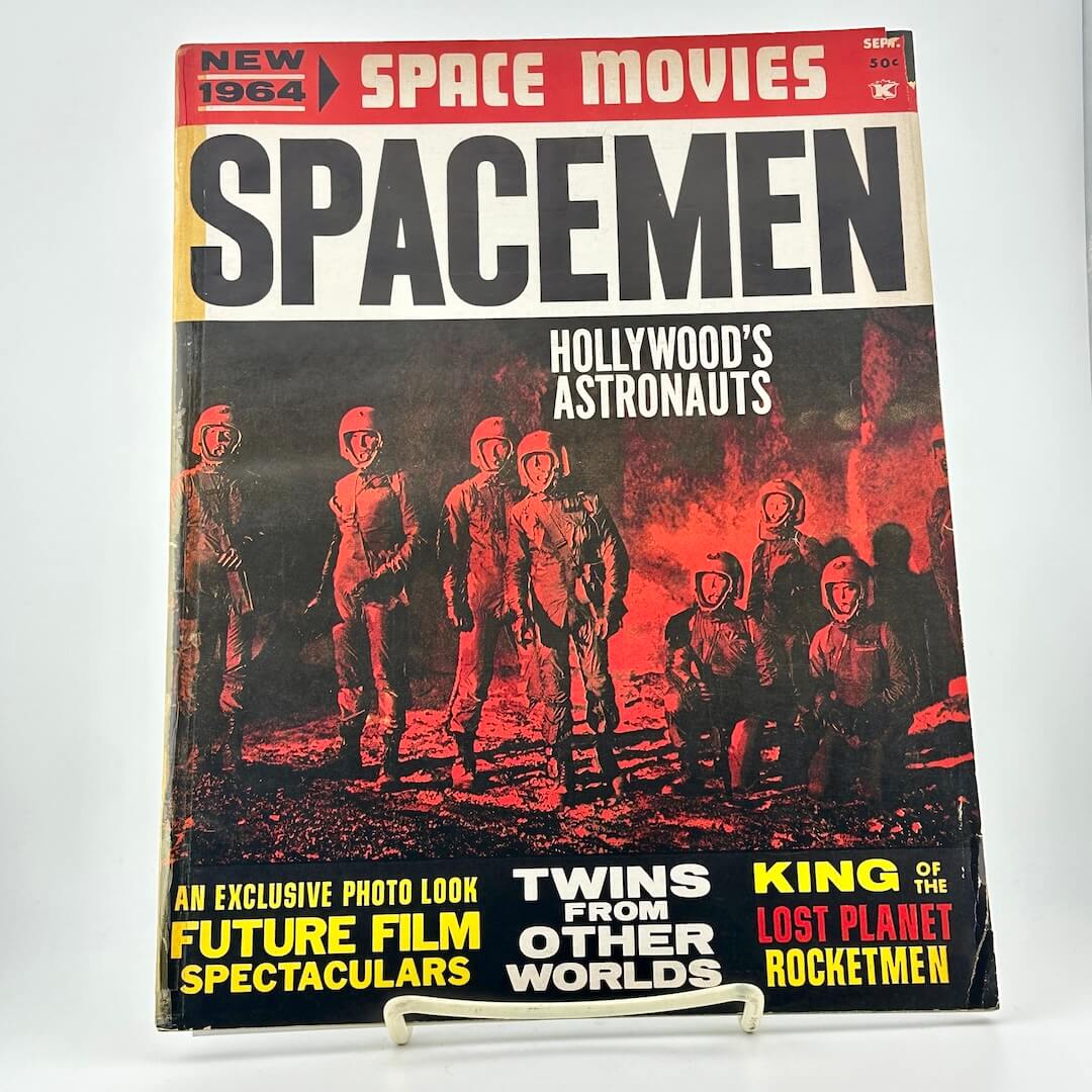 Magazine cover titled 'Spacemen' featuring astronauts on a red and black background.