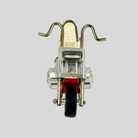 Small model motorcycle on a white background