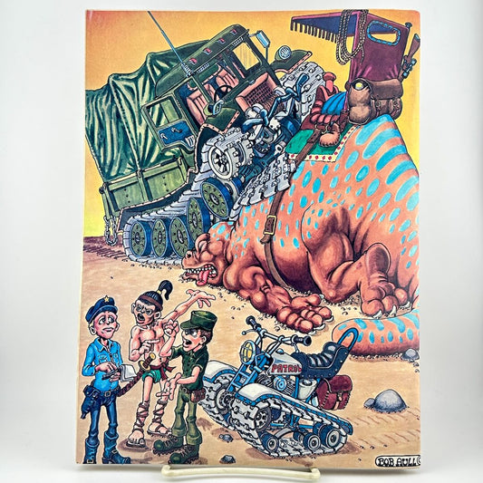 Magazine back cover showing a chaotic desert scene with a large spotted creature, and several small illustrated characters.