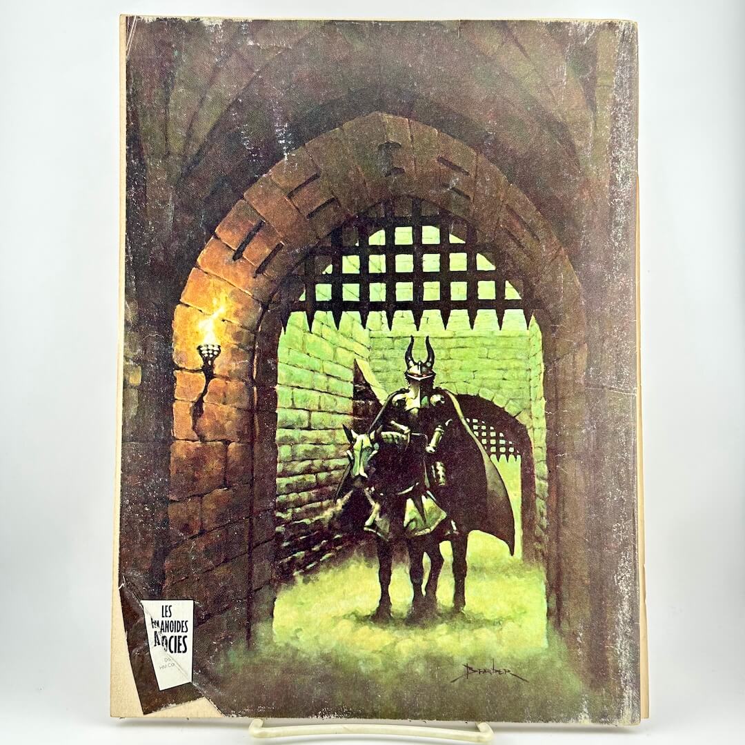 Back cover of magazine with horse-mounted person in armor behind a castle gateway.