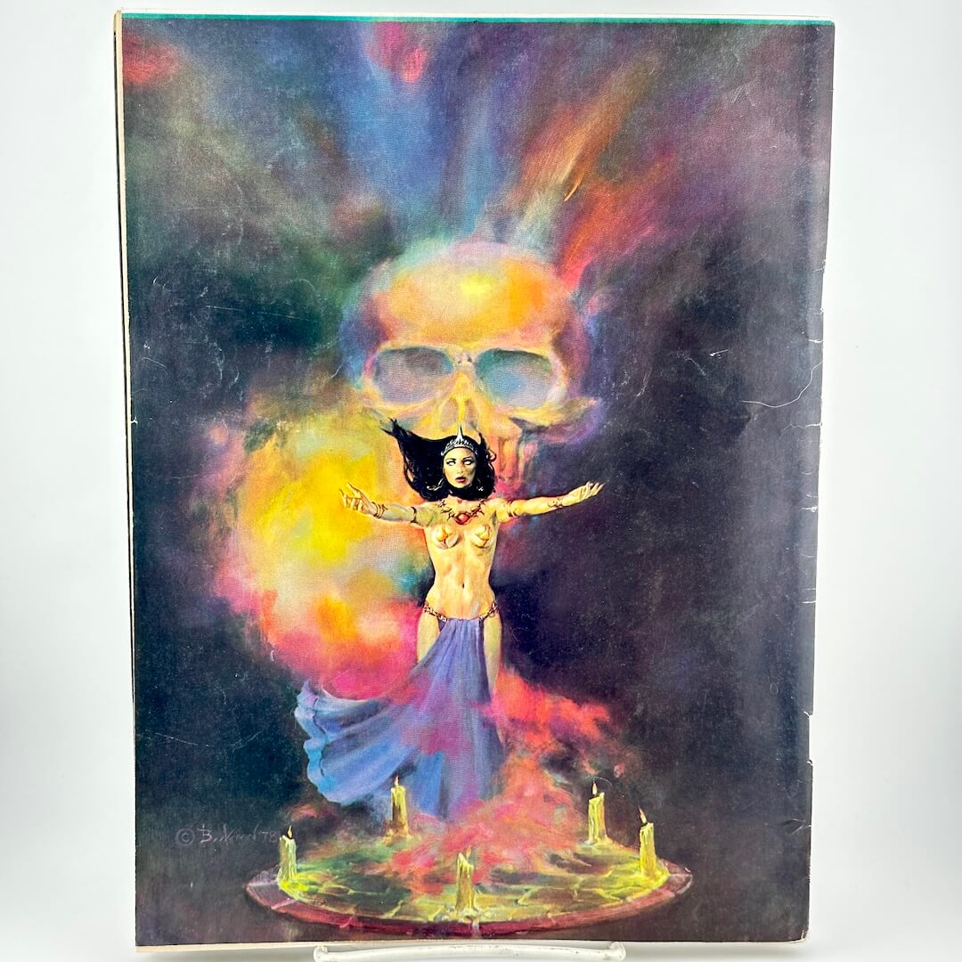 Back cover of magazine with sorceress summoning with skull in background.