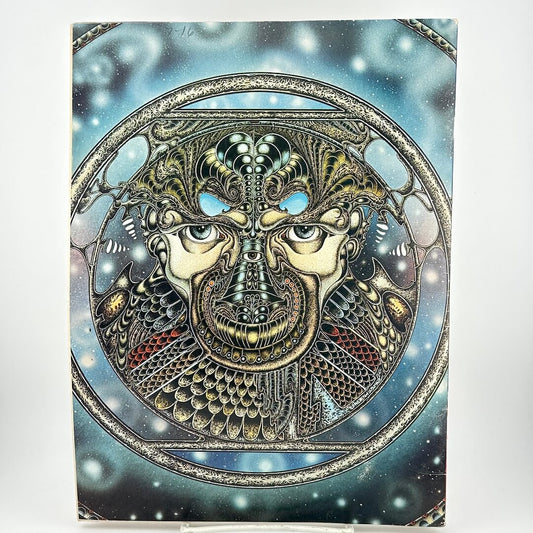 Back cover of magazine with intricate illustration of face in geometric patterns.