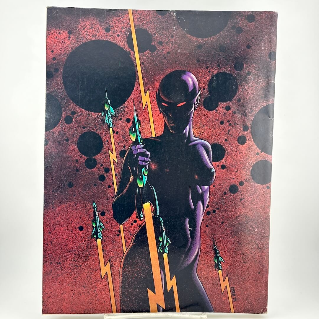 Back cover of magazine with alien figure holding lightning bolt.