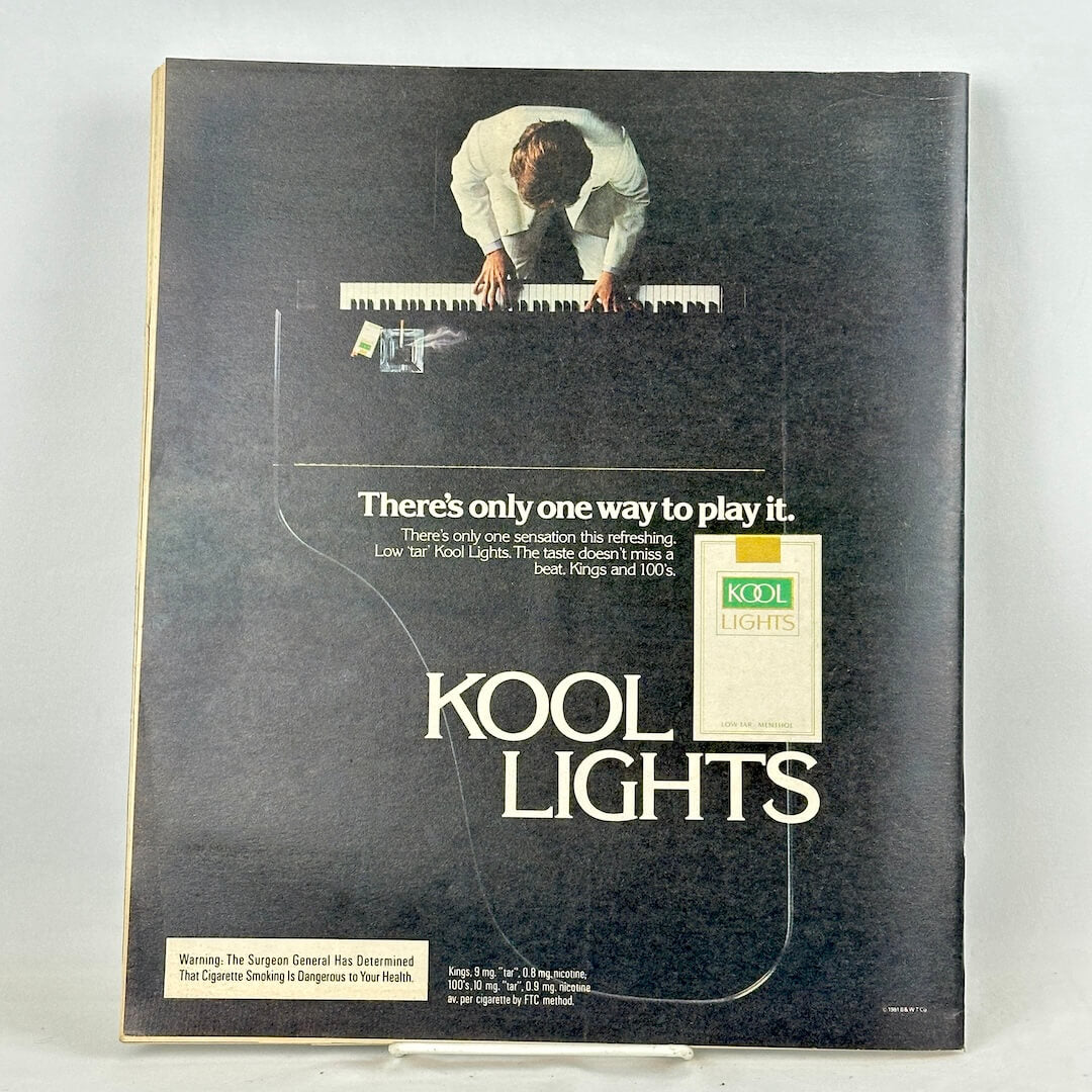 Back cover of magazine featuring an ad for Kool Lights cigarettes with image of grand piano from above.