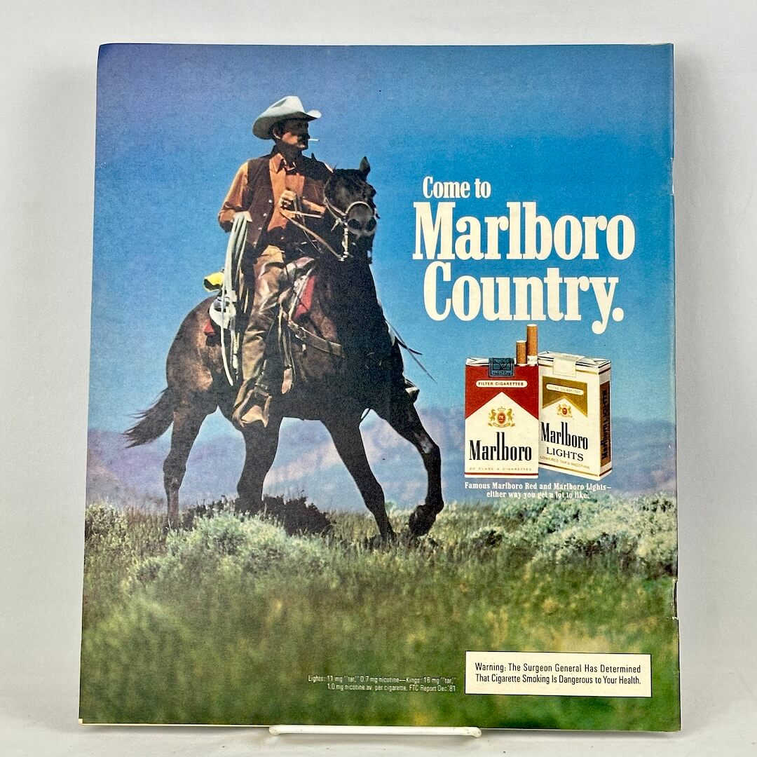 Back cover with full page ad for Marlboro cigarettes featuring a smoking, horse-mounted cowboy.
