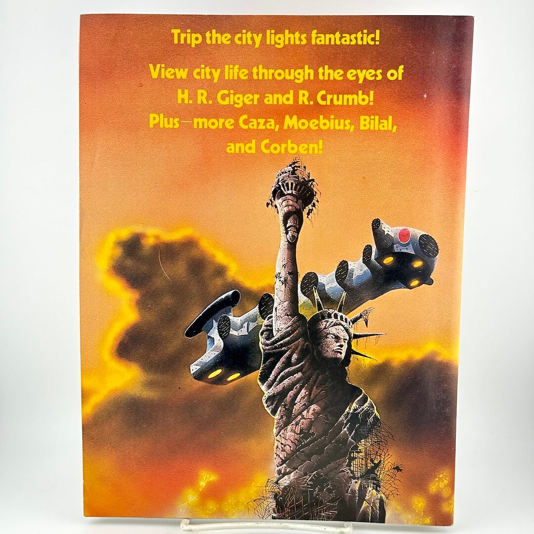 Back cover of magazine with illustration of spaceship over the Statue of Liberty under blurb about contents.