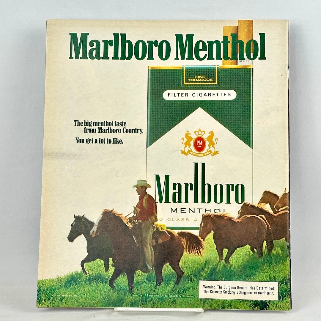 A vintage Marlboro Menthol filter cigarette pack advertisement on back cover of magazine.