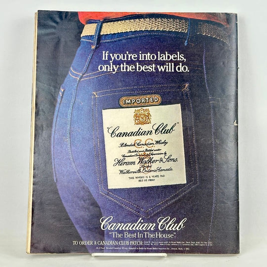 Back cover of magazine with full page ad for Canadian Club whiskey featuring image of back pockets of someone in jeans.