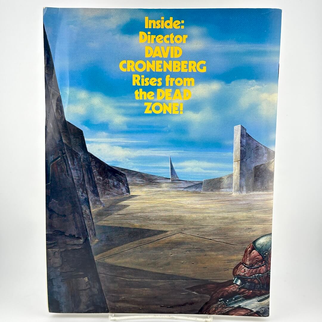 Back cover of magazine with illustration of futuristic landscape.