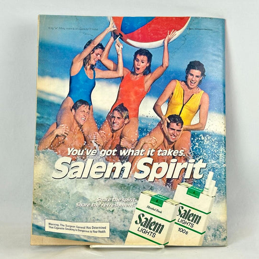 Back cover of magazine with full page ad for Salem Light Cigarettes featuring six people at the beach.