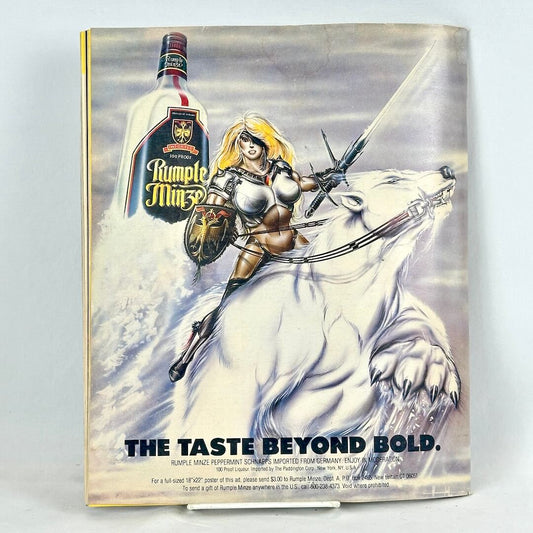 Back cover of magazine with full page ad for Rumple Minze liquor with warrior woman on the back of polar bear.