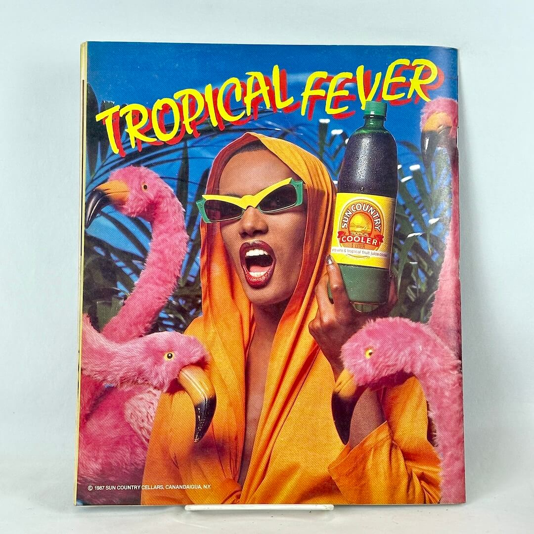 Back cover of magazine with full page ad for Sun Country Cooler drink with woman surrounded by fake flamingos.