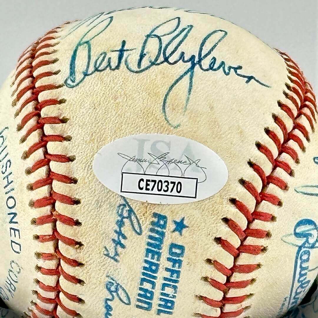 White baseball with authentication sticker.