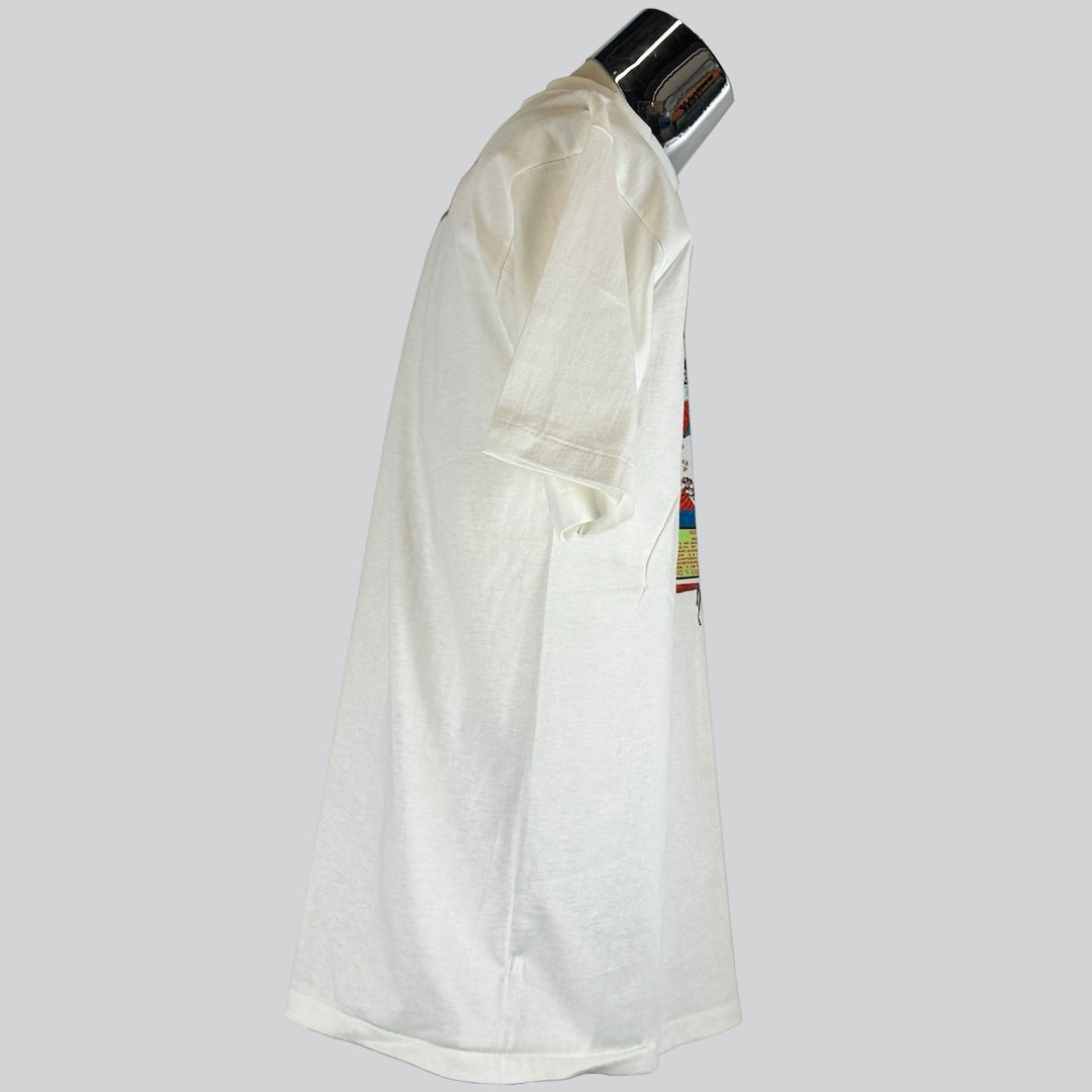 Side view  of a white Pearl Jam t-shirt.