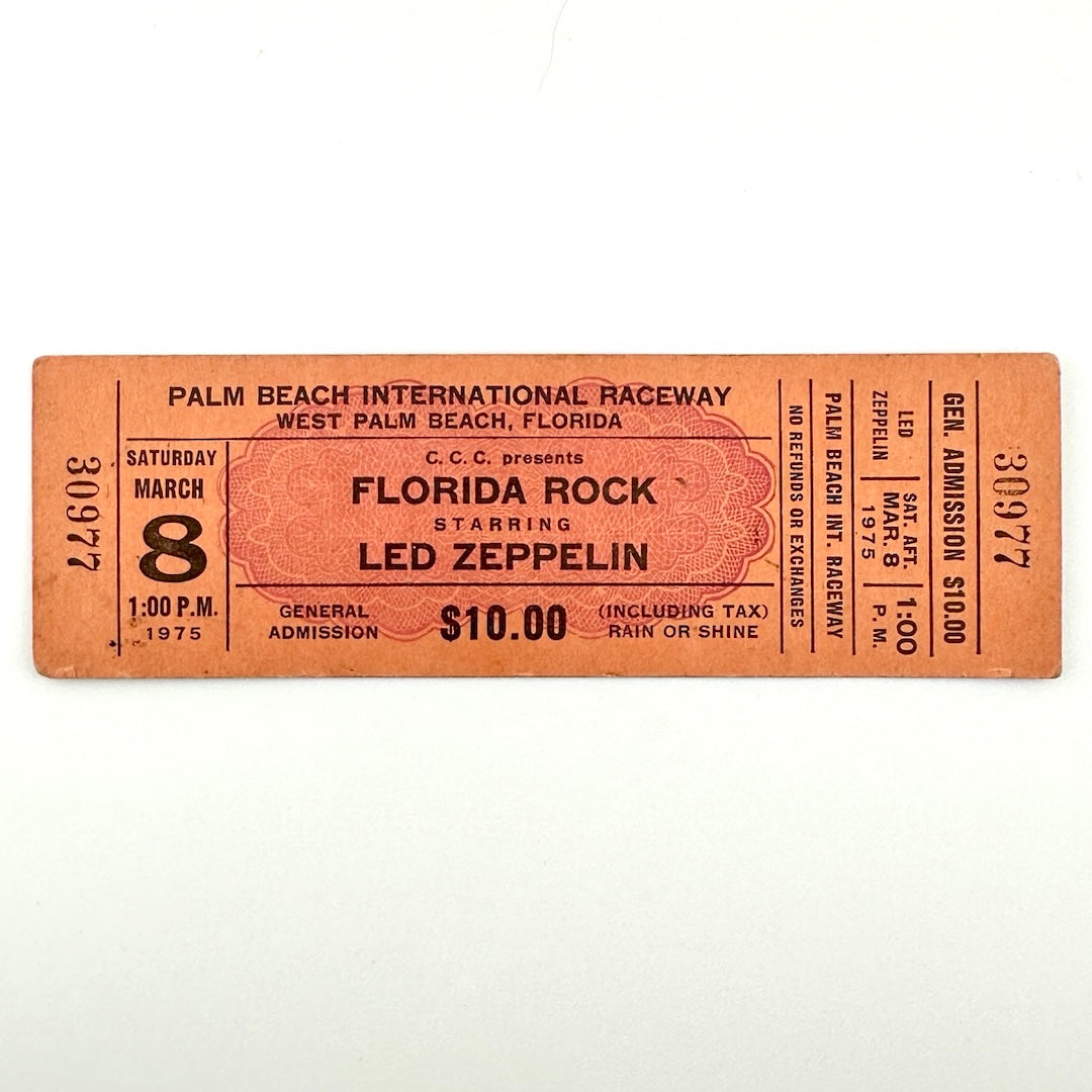 Orange rectangular concert ticket #30977 with black print for Florida Rock starring Led Zeppelin in Florida in 1975.