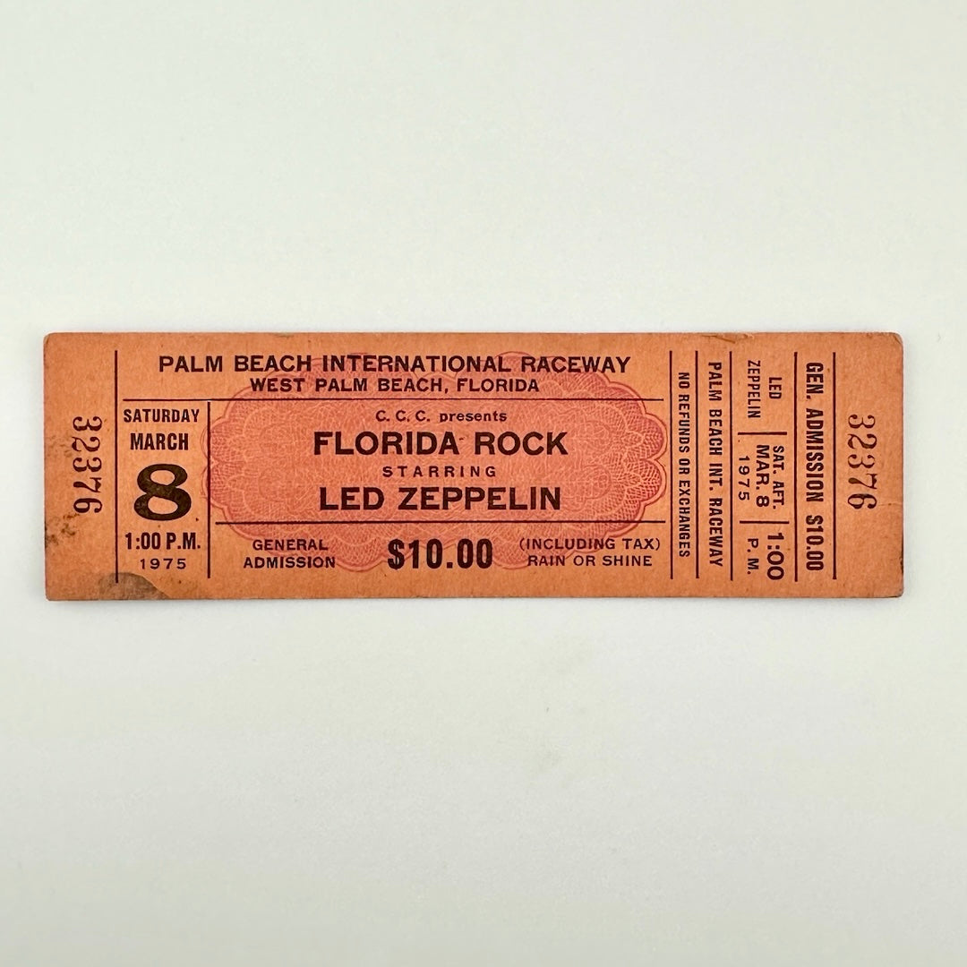 Orange rectangular concert ticket #32376 with black print for Florida Rock starring Led Zeppelin in Florida in 1975.