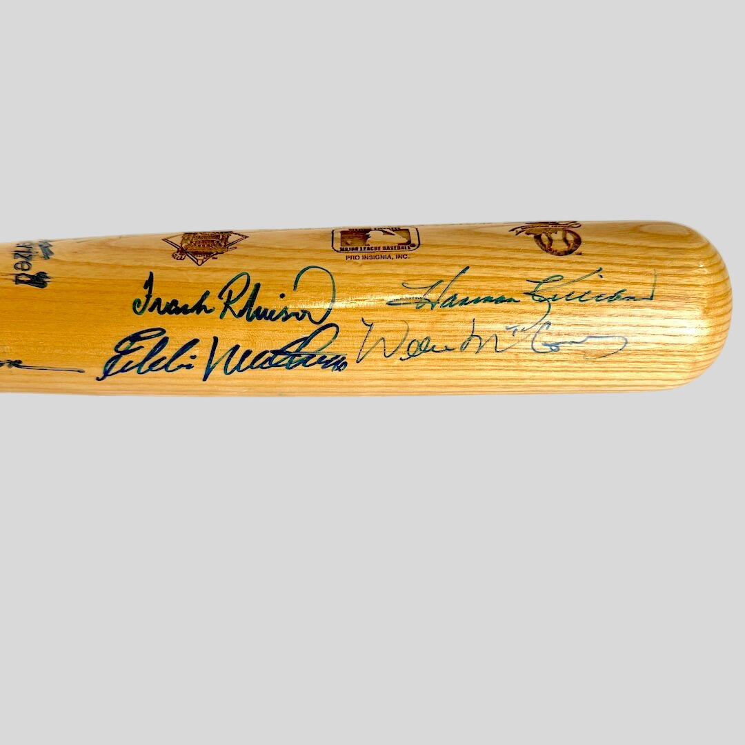 Wooden baseball bat with autographs on a white background