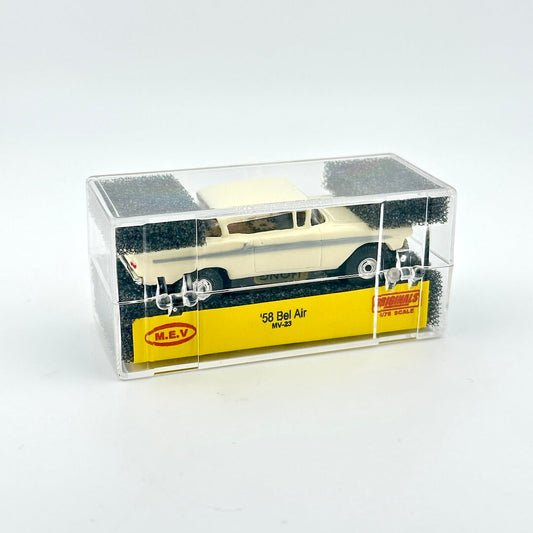 Model car in a clear display case with a white background