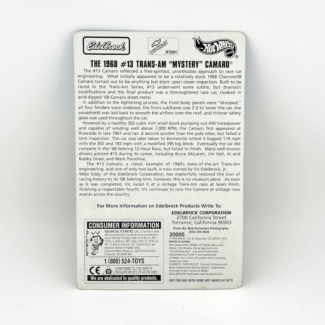 The back of a Hot Wheels Camaro packaging, featuring product specifications, & historical text.
