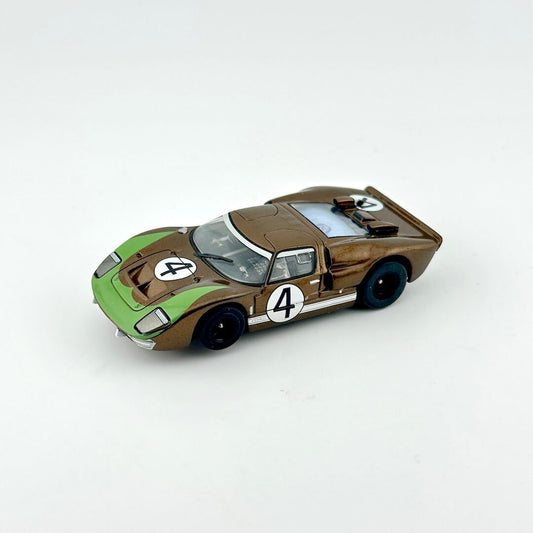 Model car with a green and brown design on a white background