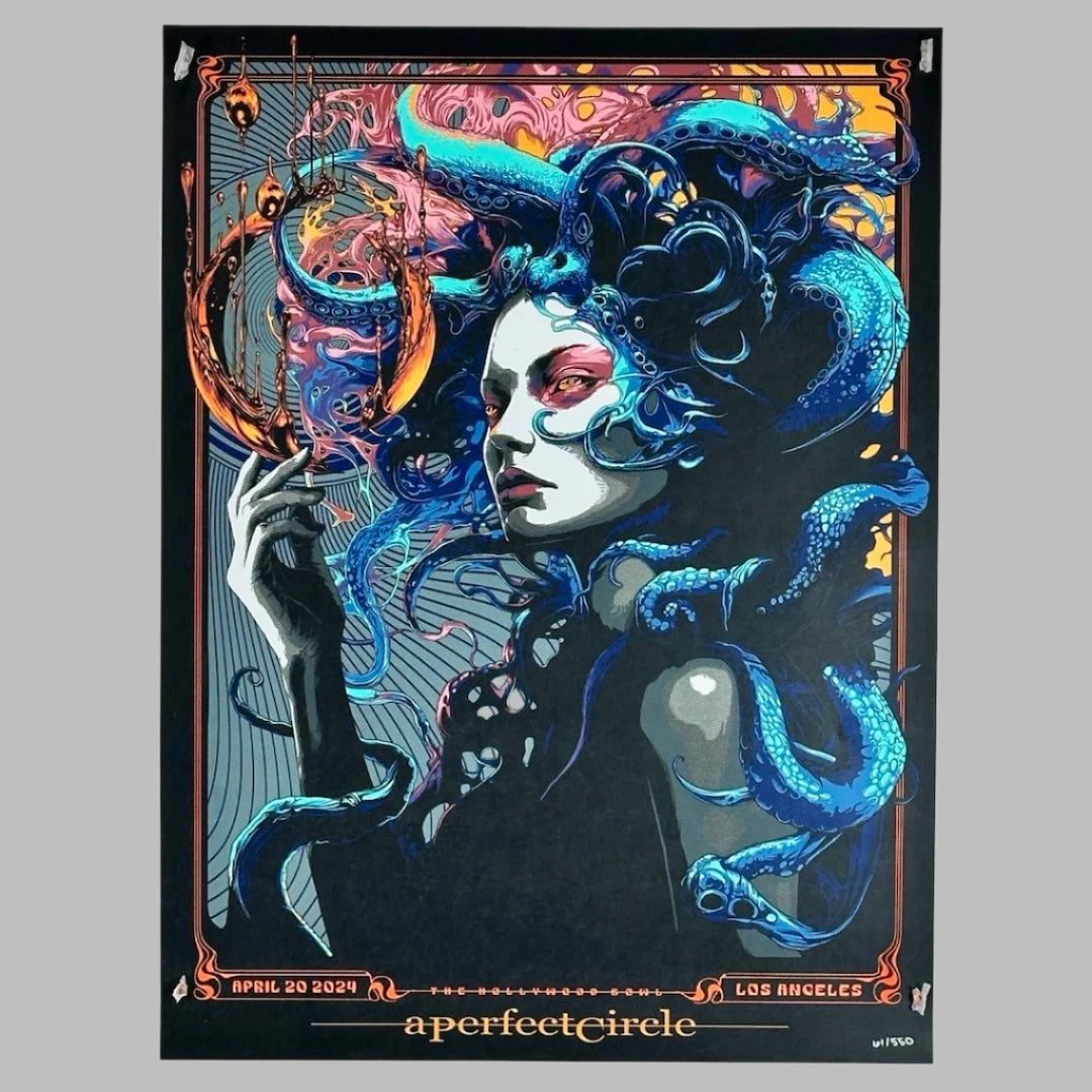 Grey & black woman with blue tentacles for hair, swirling multicolored graphics coming from her hand & framing her head