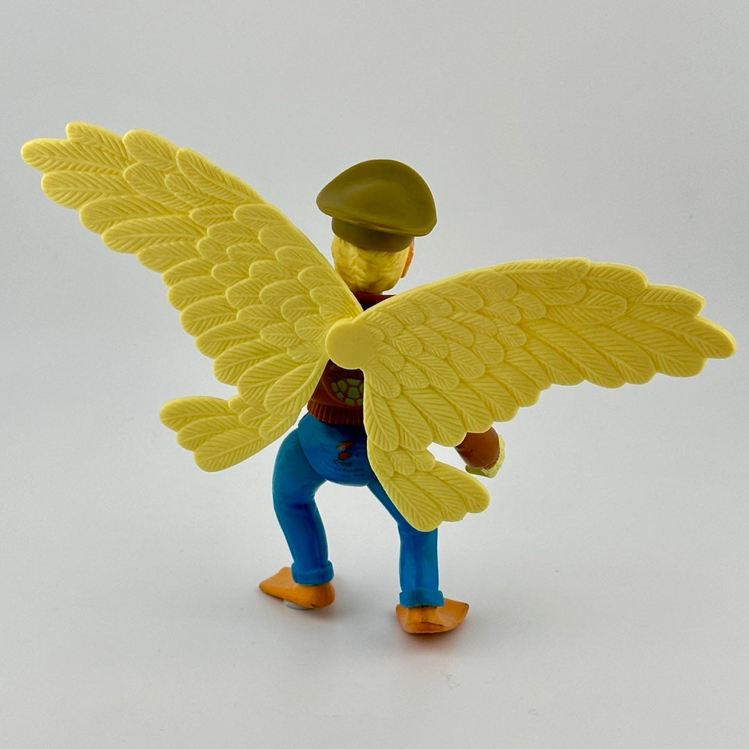 Yellow anthropomorphic bird in jeans, leather bomber jacket, & military cap. Holding white grenade. Back view.