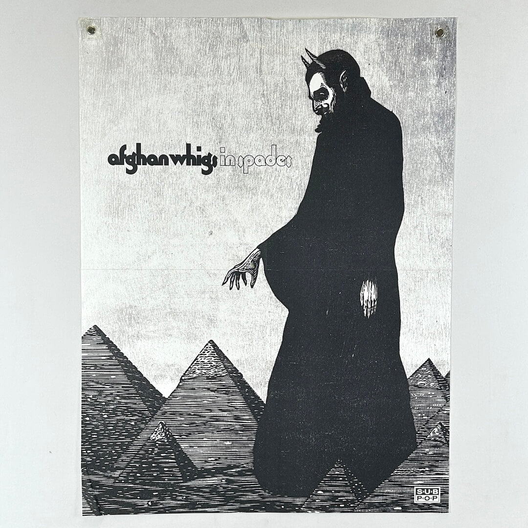 Album cover with a figure in a dark robe and pyramids, featuring the text 'afghan whigs' and 'in spades'.