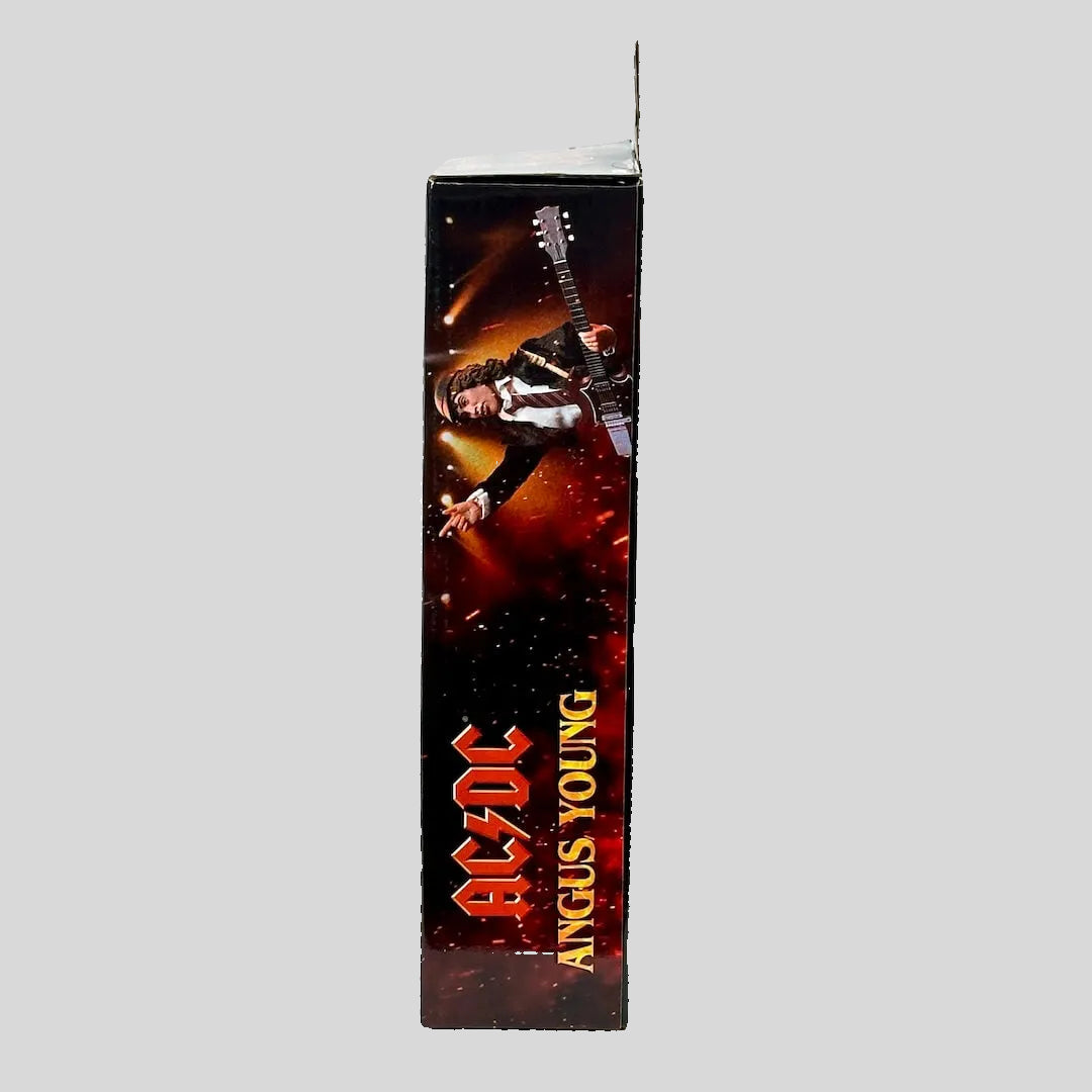 AC/DC Angus Young packaging with a guitar player against a white background