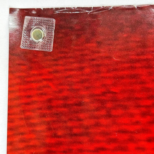 Close up of upper left corner to show creases and wear along top edge.