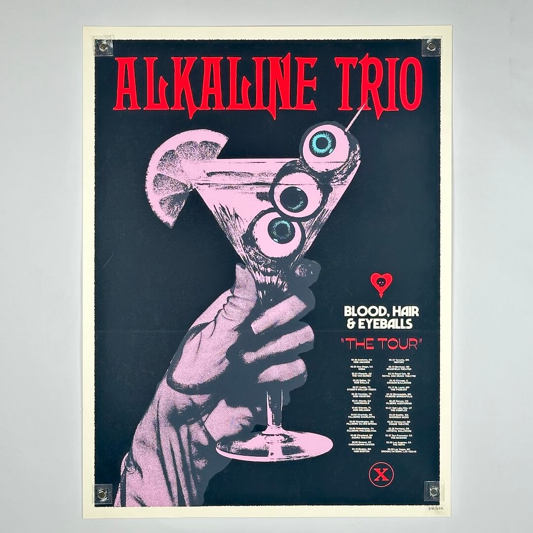 Poster of Alkaline Trio with a hand holding a cocktail with eyeball design on a dark background.
