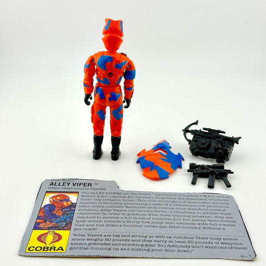 Toy figure of Alley Viper with accessories and character card on a white background