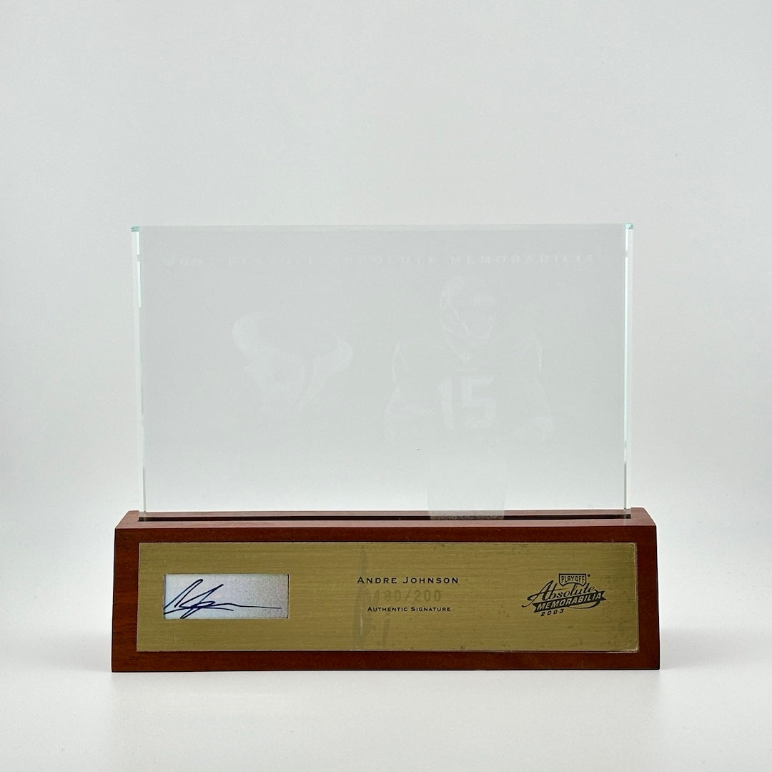 Etched glass in wooden base with gold plaque for Andre Johnson authentic signature in window at left.