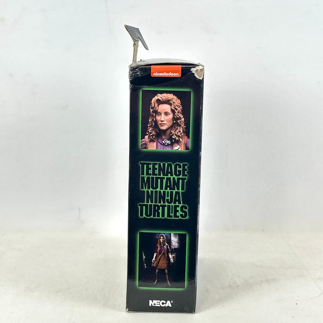 Side view of TMNT action figure packaging on light background.
