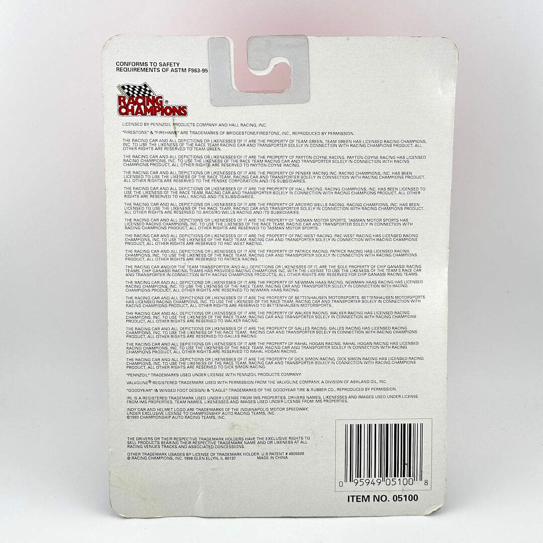 Back of a toy packaging with text and a barcode on a white background