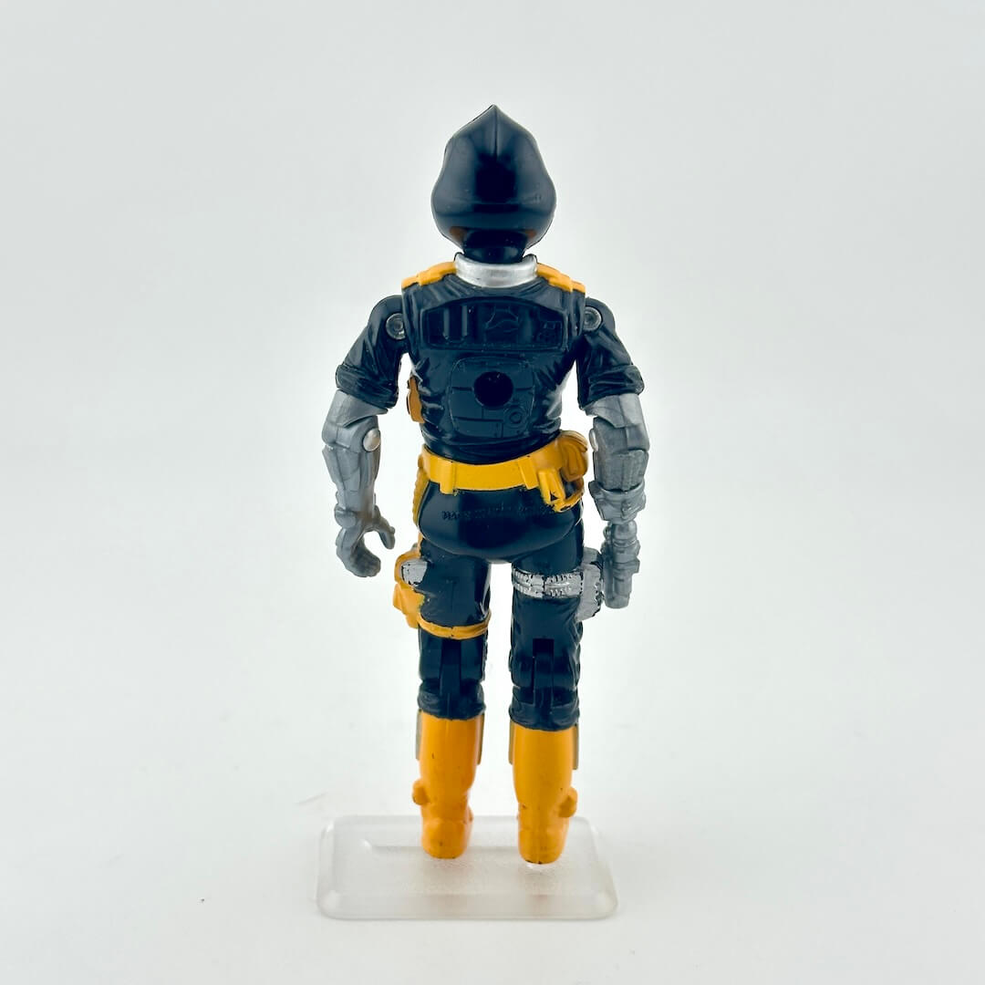 Toy figure in a black and yellow costume on a white background
