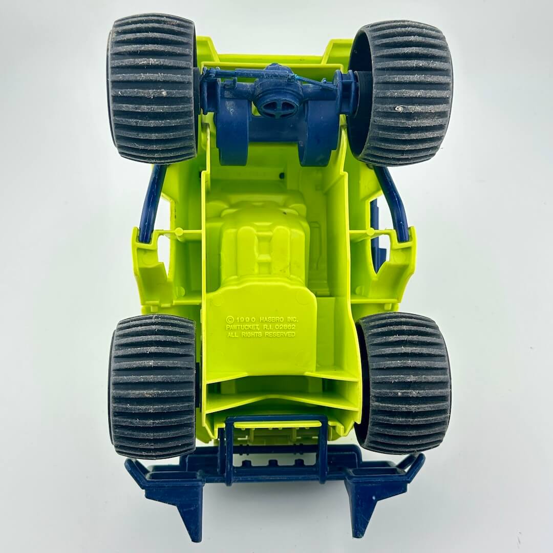 Toy vehicle with green and blue design on a white background