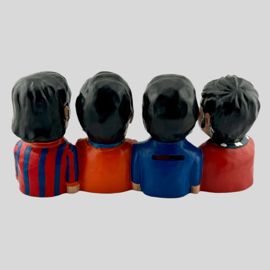 Ceramic artistic depictions of the four Beatles members in their yellow submarine style. Back view.