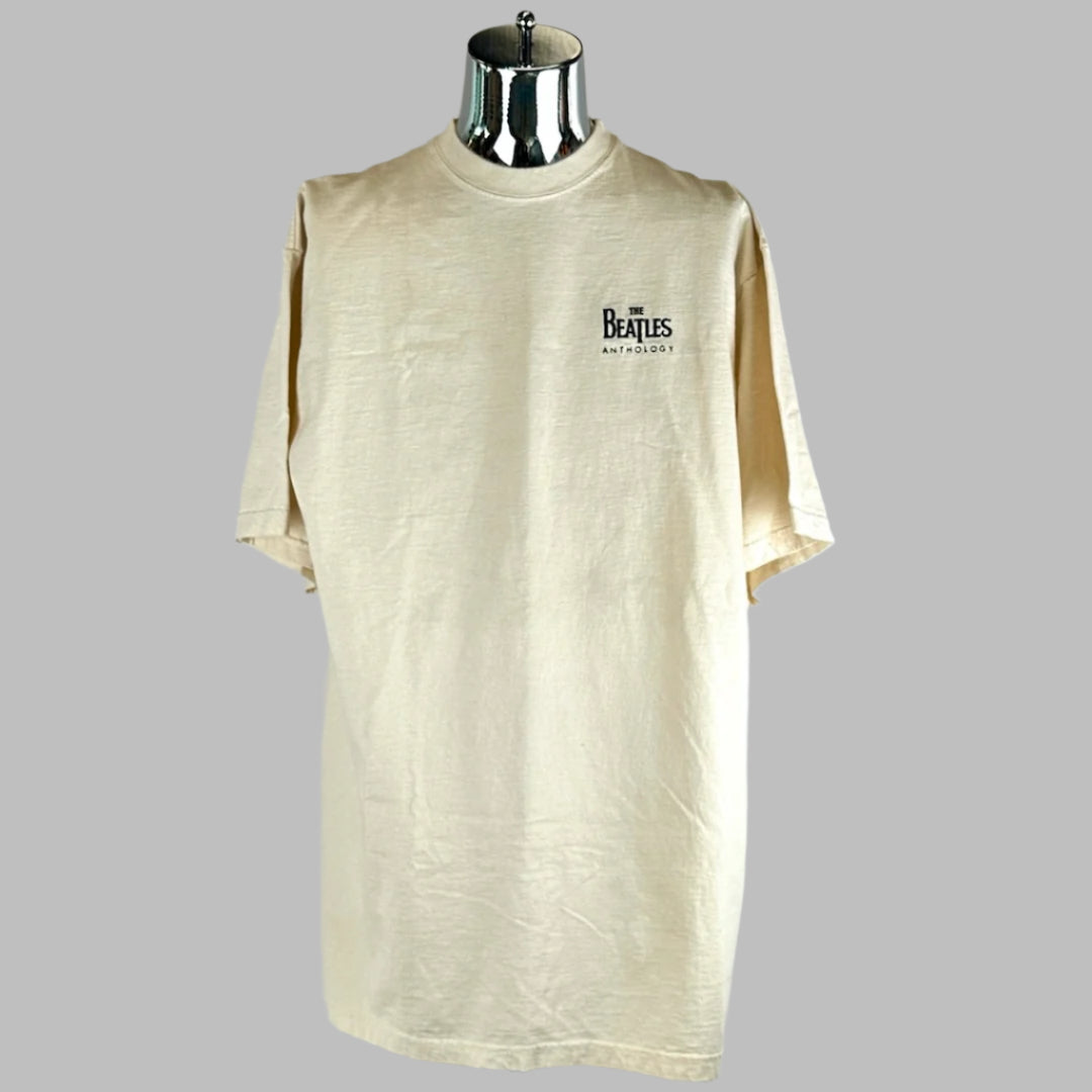 Front of tan short sleeved shirt with Beatles logo above left breast. No visible damage.