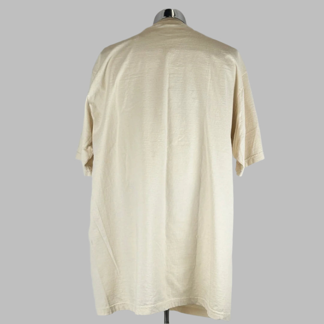 Backside of tan short sleeve shirt with no damage or markings.