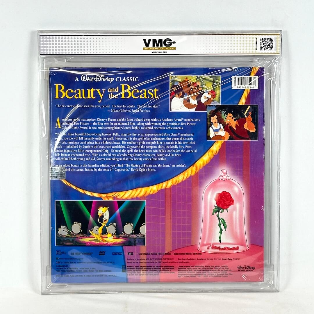 Disney 'Beauty and the Beast' laserdisc packaging with rose under glass dome illustration.