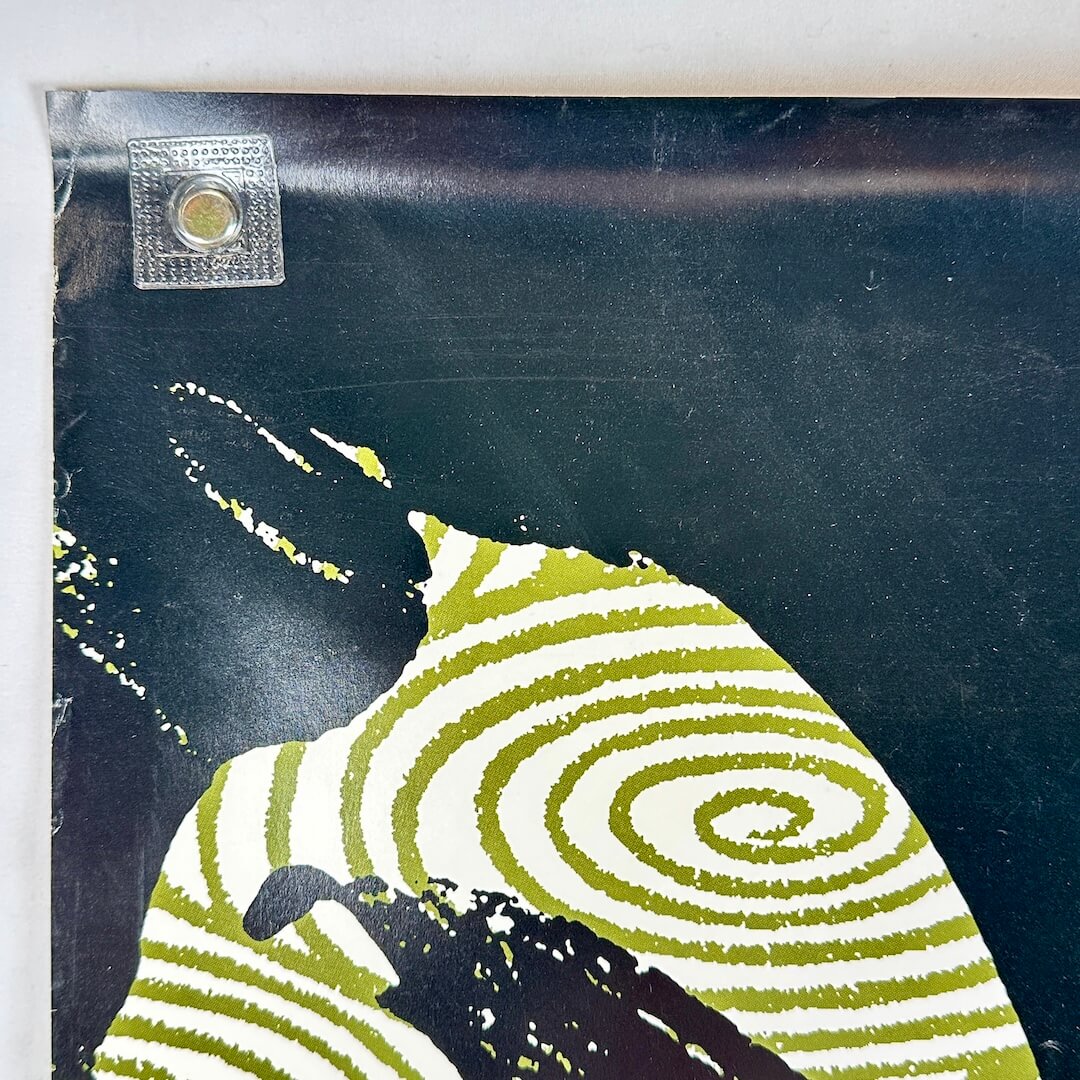 Bottom left corner of poster with crease and light scuffs.