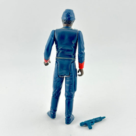 Action figure in blue suit with red and gold accents with weapon on white background.