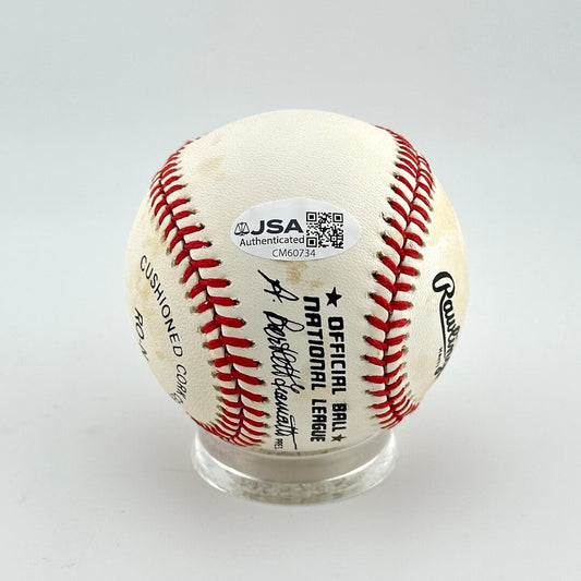 Baseball with JSA authentication label on a white background