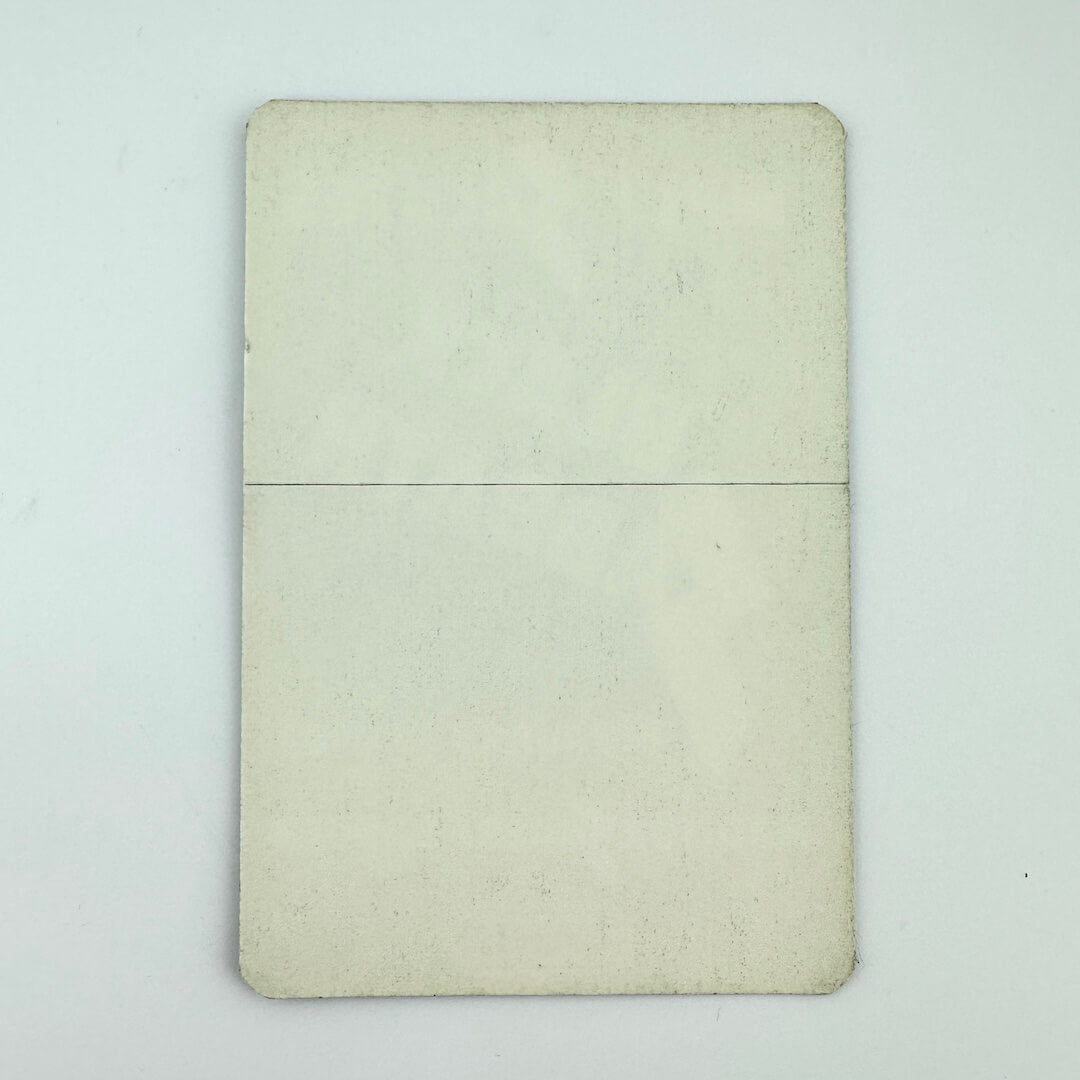 Backside of black and white fabric event pass for Black Sabbath against white background. Backing intact.