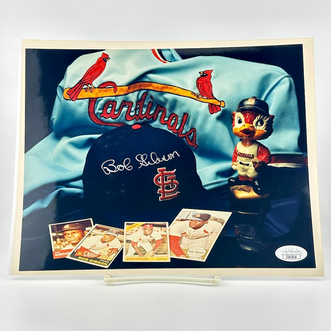 Photograph of memorabilia collage featuring signature of player, JSA authentication sticker in corner.