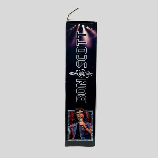 Product packaging with a portrait of a person and 'Bon Scott' text on a white background